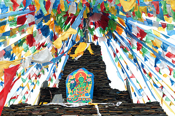 Image showing Tibetan prayer flags and mani rocks