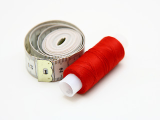 Image showing The coil of a red thread with centimeter 