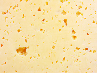 Image showing Background of fresh yellow Swiss cheese with holes