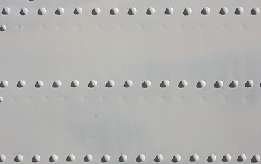 Image showing A silver painted metal aircraft background  with  rivets.