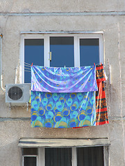 Image showing The clothes dry at a white window 