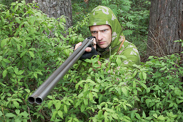 Image showing Angry hunter with an old gun