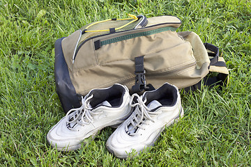 Image showing Backpack and sneakers tourists