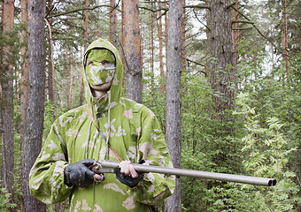 Image showing The shooter in camouflage