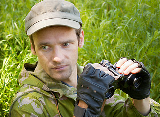 Image showing The young man conducts observation