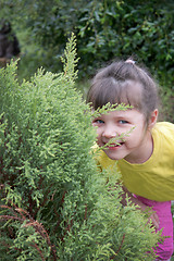 Image showing Little girl playing in hide-and-seek