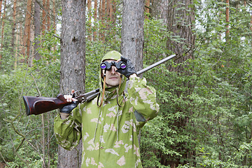 Image showing The shooter in camouflage