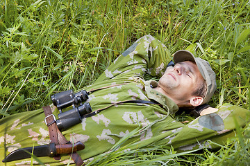 Image showing A man dressed in camouflage