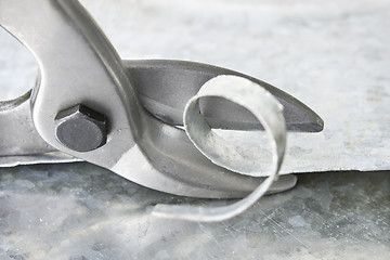 Image showing Scissors cut metal into strips