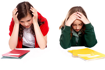 Image showing Confused students holding their heads