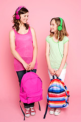 Image showing Beautiful teenagers holding school bag