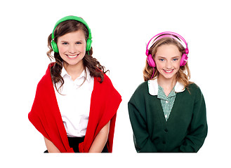 Image showing Schoolgirls listening music through headphones