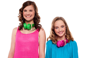 Image showing Teenagers posing with headphones around neck