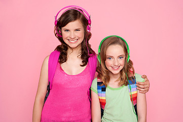 Image showing Sisters standing together and enjoying music