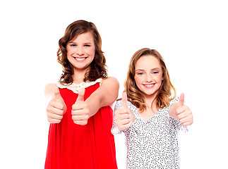 Image showing Two friends gesturing thumbs up