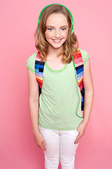 Image showing Cute girl with backpack and headphones