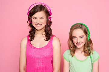 Image showing Smiling girls posing with headphone