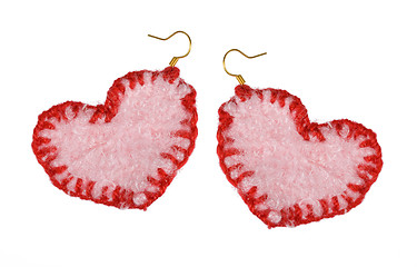 Image showing earrings in the form of the heart. Collage.