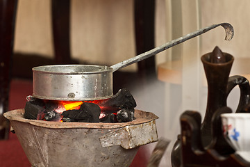 Image showing Roasting raw coffee using coal