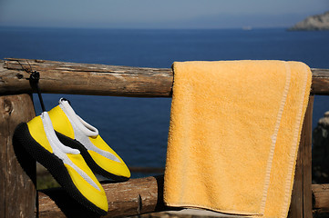 Image showing Yellow Beach Shoes and Towel