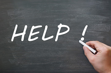 Image showing Help written with chalk on a blackboard background