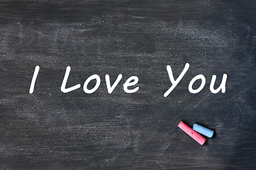 Image showing I love you - written with chalk on a Smudged blackboard background