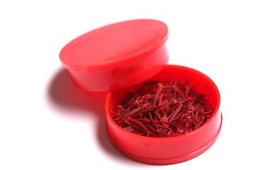 Image showing saffron threads in a red beverage