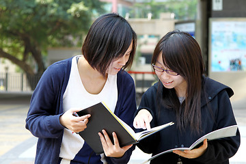 Image showing Asian students studying and discussing in university