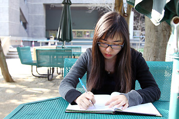 Image showing Asian girl studying in university