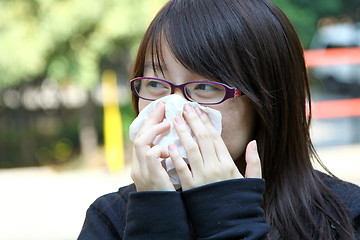 Image showing Asian sneeze girl