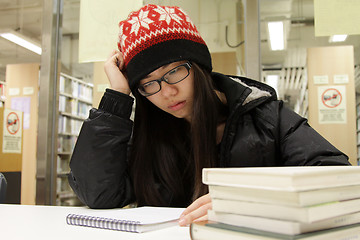 Image showing Asian woman studying in library