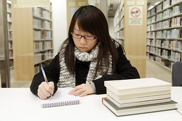 Image showing Asian woman studying in library