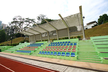 Image showing Stadium chairs and running track
