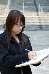 Image showing Asian girl studying in university