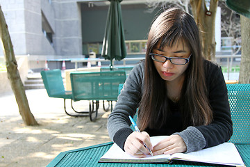 Image showing Asian girl studying in university