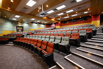Image showing Lecture hall with colorful chairs in university