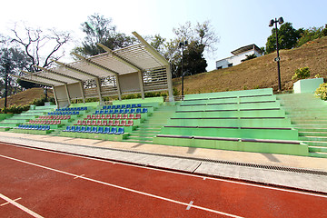 Image showing Stadium seats and running track