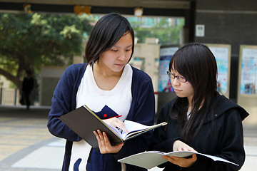 Image showing Asian students studying and discussing in university