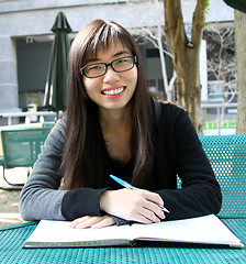 Image showing Asian girl studying in university