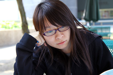 Image showing Asian girl thinking 