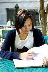 Image showing Asian girl studying in university