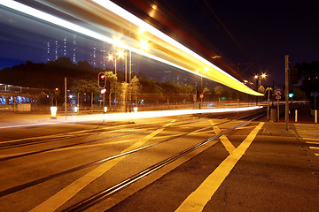 Image showing Colorful light rail at night in city