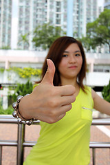 Image showing Asian woman with thumbs up