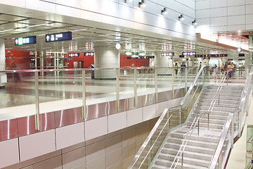 Image showing Moving people in train station during rush hours