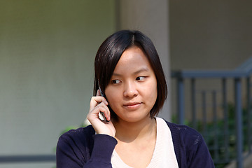 Image showing Asian woman talking phone