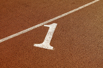 Image showing Number one of the running track in a stadium