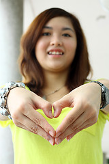 Image showing Asian woman making a heart