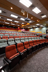 Image showing Lecture hall with colorful chairs in a university