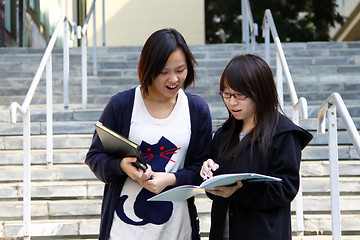 Image showing Asian students studying and discussing in university