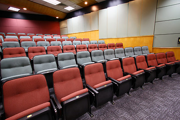 Image showing Lecture hall with colorful chairs in university